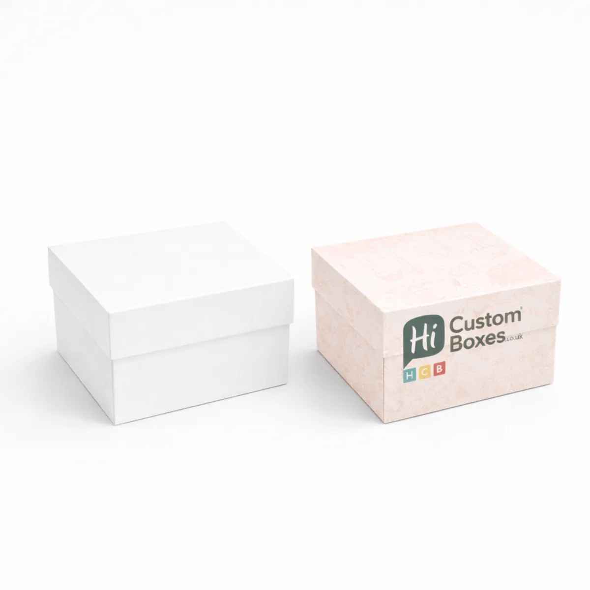 Two square two-piece rigid gift boxes featuring a clean white design and a floral pink pattern- class=